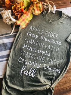 Share what you love about fall with this fall favorites shirt! Autumn Shirt Ideas, Autumn Tshirt Designs, Fall Coffee Shirts, Fall T-shirt, Diy Fall Shirts Vinyl, Trendy Green T-shirt For Fall, Long Sleeve Shirt With Letter Print For Fall, Fall Graphic Tee Shirt With Long Sleeves, Long Sleeve Graphic Tee For Fall