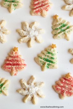 christmas cookies decorated with icing and sprinkles in the shape of trees