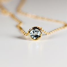 "This 14k solid gold dainty minimal birthstone necklace is bezel set and sliding style. Perfect Gift for Anniversary, Birthday or any Special Occasion to show someone you love them! DETAILS   14k solid yellow gold.  Pendant dimension is 5mm x 5mm   Necklace length is 16\"      Genuine birthstones are 4mm round cut. (0.25 ct.)  Available all birthstones from drop down menu.  14k solid gold bezel setting. * January - Garnet * February - Amethyst * March - Aquamarine * April - Lab white sapphire * Swiss Blue Topaz Necklace, Birthstone Necklace Mothers, Blue Topaz Necklace, Solid Gold Necklace, Topaz Pendant, Topaz Necklace, 14k Gold Necklace, Necklace Minimalist, Valentines Gifts For Her