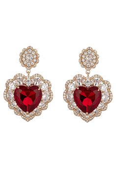 Get ready for the upcoming Valentine's Day holiday by garnering our Red Valentine Dangle Earrings! These dangle earrings boast ravishing red zirconia crystals that are encased within glimmering gold brass heart pendants for an extra special glow. Your Valentine's Day outfit is sure to be complete when you have these drop earrings on! Product Details: Material: Brass Stones: CZ crystals Measurements: approx. 1.5" length Closure: push-back Fairy Tale Jewelry, Heart Dangle Earrings, Red Jewelry, Valentine's Day Outfit, Cubic Zirconia Earrings, Zirconia Earrings, Queen Of Hearts, Cute Earrings, Heart Design