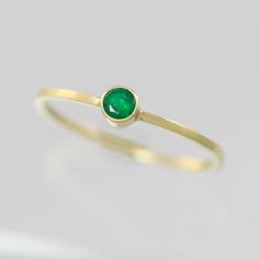 Handcrafted 14 carat yellow gold ring with a 3mm A grade faceted round Emerald stone in a bezel setting. Ring band measures 1mm wide and 1mm thick. Very dainty and elegant! Looks great stacked with other rings. Makes an excellent Mother's Ring! This item is made to order in your desired ring size, prices vary depending on requested size. Looks great paired with the necklace: https://www.etsy.com/listing/123058315/emerald-drop-necklace-in-14k-yellow-gold? Or the pendant: https://www.etsy.com/list Minimalist Gold Emerald Stackable Ring, Classic 14k Gold Birthstone Ring With Bezel Setting, Classic 14k Gold Stackable Rings With Bezel Setting, Minimalist Emerald Ring In Yellow Gold For Everyday, Minimalist Yellow Gold Emerald Ring For Everyday, Everyday 14k Gold Solitaire Emerald Ring, Minimalist Oval Emerald Ring With Bezel Setting, Everyday Yellow Gold Solitaire Emerald Ring, Classic 14k Gold Birthstone Ring With Smooth Bezel