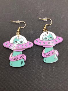 Take me, Saucer Kitties These painted acrylic charms are attached to gold stainless steel findings and fish hook ear wire. Acrylic Charms, Cat Earrings, Fish Hook, Ear Wire, Last Minute Gifts, Favorite Jewelry, Jewelry Earrings Dangle, Etsy Earrings, Dangle Drop Earrings