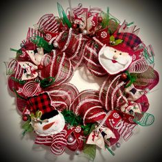 a christmas wreath with santa claus and other decorations