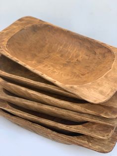 a stack of wooden plates sitting on top of each other