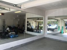 a garage filled with lots of equipment and mirrors