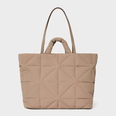 This Kate Tote Handbag from A New Day™ in a solid color showcases an unstructured silhouette with a geometric quilted finish for a chic, textured look and it goes well with any of your outfits. The interior accessories pocket, zip pocket and exterior side pockets help keep your belongings organized. Designed with a magnetic closure, this stylish tote handbag is easy to carry with double shoulder and grab handles. A New Day™: Style that goes wherever you do. Knitting Tote, Work Tote, Tote Handbag, Nylon Bag, A New Day, Magnetic Closure, Interior Accessories, Handbag Accessories, Tote Handbags