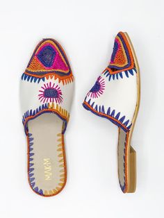 handmade slides made out of rafia. Made in Morocco.  Multi-color model. Handmade Casual Mules, Handwoven Mules For Spring, Multicolor Slip-on Mules For Beach, Multicolor Slip-on Beach Mules, Handmade Bohemian Mules For Spring, Handmade Casual Mules For Summer, Handmade Mules For Summer Vacation, Handmade Artisan Mules For Summer, Handmade Summer Mules For Vacation