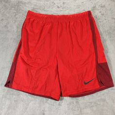 Elevate Your Workout Gear With These Nike Shorts In Size 2xl. The Blue Dri-Fit Fabric Ensures Comfort And Functionality During Your Active Sessions. The Athletic Style Features Dark Blue Trim And A Nike Character Detail, While The Regular Fit And Elastic Waistband Provide A Secure And Comfortable Fit. Perfect For Any Occasion, These Shorts Are Ideal For Men Who Value Performance And Style. Red Nike Gym Bottoms, Casual Red Go-dry Shorts, Nike Red Moisture-wicking Bottoms, Red Nike Athletic Shorts, Nike Red Workout Shorts, Red Nike Workout Bottoms, Dark Blue Trim, Mens Gym Shorts, Nike Basketball Shorts