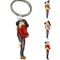 two people are hugging each other while the keychain is shaped like an image