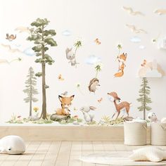 an animal themed wall sticker in a children's room with white walls and wooden floors