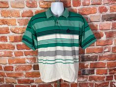 "90s Izod striped polo. Lightly used no major issues MEASURES -  23\" pit to pit and 26.5\" long in front, 29\" long in back TAGGED - ~ BE SURE TO CHECK OUT MY ENTIRE SHOP ~ - This is a TRUE VINTAGE item! Vintage clothing sizing varies wildly ALWAYS use the measurements and info provided in the listing to assure proper fit! Unless the words \"deadstock\" or \"unworn\" are used please understand this is a USED item. RETURNS - My policy is NO RETURNS but I will make an exception if you agree to cover the return shipping as well as forfeit the shipping I paid to ship the item. If I made an error I will make it right 100% but I am not responsible if you change your mind/\"item does not fit\". Please use the measurements provided if you don't know how ask me I will gladly help you :) ** Why buy Green Collared T-shirt For Streetwear, Casual Green Polo Shirt For Streetwear, Retro Green Short Sleeve Polo Shirt, Green Cotton Polo Shirt For Streetwear, Green Short Sleeve Polo Shirt For Streetwear, Vintage Green Short Sleeve Polo Shirt, Vintage Green Polo Shirt With Polo Collar, Green Polo Shirt With Striped Collar And Short Sleeves, Green Short Sleeve Polo Shirt With Striped Collar