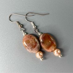 Handmade Pearl & Gemstone Earrings By Desert Beads Peach Faux Pearls And Natural Gemstone Beaded Dangle Earrings. Pearl Seed Beads Add Just The Right Pop. These Drop Earrings Will Make A Lovely Addition To Your Jewelry Collection. The Creamy Tones Will Go Well With Fall And Winter Outfits. Overall Length Is Approximately 2". Silver Plated Findings And Ear Wires. New & Handmade In My Arizona Jewelry Design Studio. Please Let Me Know If You Have Any Questions. Ready To Ship. Note Colors May Be Sli Gemstone Earrings Handmade, Fall Beaded Jewelry, Arizona Jewelry, Fall And Winter Outfits, Jewelry Design Studio, Gemstone Earrings Dangle, Brown Earrings, Natural Jewelry, Pearl Dangle Earrings