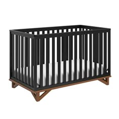 a black crib with white sheets on the bottom, and a wooden bed frame