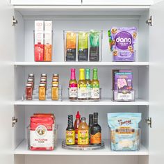 an open pantry filled with lots of different types of food and condiments on shelves