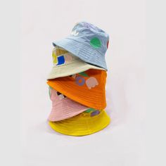 Studio Blinky x All Small Co Funny Shapes Bucket Hat | All Small Co – All Small Co. Retro Multicolor Bucket Hat For Summer, Trendy Multicolor Bucket Hat For Spring, Casual Cotton Patchwork Hat, Blue Bucket Hat For Summer, Fun Multicolor Bucket Hat For Spring, Funky Multicolor Summer Hat, Trendy Multicolor Bucket Hat, Funky Summer Hats, Fun Yellow Bucket Hat For Spring