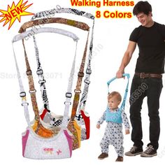 a man holding onto a child's walking harness