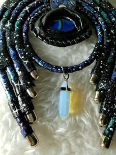 This is a unique necklace crafted from genuine leather, painted with acrylics, hand-painted dragon-eye stylized glass eye and natural moonstone, this unique necklace will protect you from ill will and will give you compliments from anyone who sees it. To see more of my products visit my page in Instagram https://www.instagram.com/mariyana.sobol Adjustable Fantasy Necklaces For Fantasy Events, Adjustable Fantasy Necklace For Fantasy Events, Handmade Fantasy Choker For Festivals, Handmade Fantasy Festival Choker, Mystical Handmade Jewelry For Fantasy Events, Unique Handmade Necklaces For Fantasy Events, Adjustable Fantasy Necklaces For Cosplay, Adjustable Fantasy Necklace For Cosplay, Handmade Fantasy Necklaces For Larp