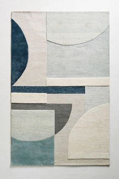 an abstract rug with various shapes and colors