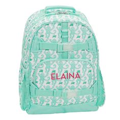 a green and white backpack with the name elaina on it