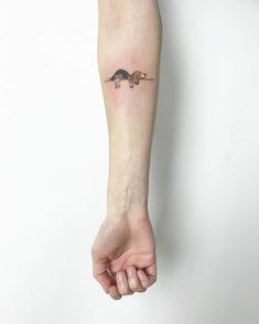 a person with a small tattoo on their arm