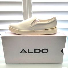 Nwt Aldo Crendan Light Weight White With Gold Trim Slip On Sneaker. Brand New In Box. Size 9. White Synthetic Slip-ons With Perforated Toe Box, White Slip-ons With Branded Insole, White Flat Synthetic Slip-ons, White Slip-ons With Perforated Toe Box For Summer, White Perforated Toe Box Slip-ons For Summer, White Perforated Slip-ons For Summer, Chic Slip-on Synthetic Sneakers, Chic Synthetic Slip-on Sneakers, Chic White Slip-ons For Spring