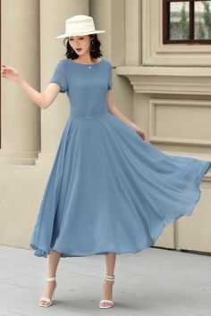 This chiffon dress is a vision of grace and elegance, presented in a serene sky blue that evokes the tranquility of a clear day.  The lightweight chiffon material adds an airy and ethereal quality to the dress, making it an ideal choice for occasions that call for a blend of comfort and refined style. DETAILS * Made of Chiffon fabric, fully chiffon liner * Midi dress * Without pockets * Fitted waist to show off your curves * Concealed Back zip closure  * Perfect for summer * Wash by hand or machine with cold water MODEL SIZE Bust:85 cm(33.4") Waist:67 cm(26.7") Height: 168cm(5'6") She wears size XS CUSTOM MADE SERVICE If you * Need a tailored clothes with your body measurement * Need a Better fit * Can't find your size in the size Chart * Make this clothes in other Color * Change the style Blue Chiffon A-line Maxi Dress, Elegant Flowy A-line Chiffon Dress, Flowy Knee-length Chiffon Wedding Dress, Formal Knee-length Chiffon Dress, Solid Color A-line Chiffon Midi Dress, Chiffon A-line Midi Dress, Solid Color Chiffon A-line Midi Dress, A-line Chiffon Midi Dress For Weddings, Chiffon A-line Dress