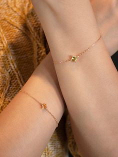 Peridot is August's birthstone which symbolizes strength. As a healing gemstone, Peridot attracts luck, love and wealth. Our dainty Peridot bracelet bears the gem's signature light green colour and is a perfect gift to yourself or a special person in your life.Style No. 1003W20/007A DETAILS• Charm diameter: 8 mm• Adjustable chain length: 16 cm / 19 cm / 21 cm• Closure: Spring ring claspMATERIAL• Vermeil: sterling silver with 14k real gold plating • Gold plating thickness: 2.5 micron• Peridot cry Citrine Gemstone Jewelry For May Birthstone, Green Citrine Jewelry For Gifts, Green Citrine Jewelry Gift, Minimalist Gold Bracelets With May Birthstone, Minimalist Yellow Gold Bracelet For May Birthstone, Sterling Silver Yellow Gold Bracelets With Birthstone, Delicate Gold Bracelets With Birthstone, Yellow Gold May Birthstone Bracelets, Yellow Gold Bracelet With May Birthstone Gemstone