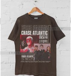 Chase Bleached Bootleg 90s atlantic shirt, Tour 2023 Chase atlantic Album shirt, Chase atlantic shirt,Gift for men women unisex tshirt All t-shirts are custom made to order and are printed using the latest ink to garment technology, a technology superior to heat transfer or screen print. - Heather colors are 52% combed and ring-spun cotton, 48% polyester - Athletic and Black Heather are 90% combed and ring-spun cotton, 10% polyester - Solid Colors 100% pre-shrunk cotton - Fiber content may vary by color FOR THE BEST FIT; (See Size Chart in Images). 1) Lay a t-shirt on a flat surface. 2) Measure the chest area, just under the armpit from side to side find the shirt's width. 3) Then measure the length from top of the shoulder to the bottom of the shirt to find the shirt's length. 4) After ta Chase Atlantic Shirt, Chase Atlantic, Unisex Tshirt, Gift For Men, Unisex Sweatshirt, Unisex Hoodies, Mens Gifts, Really Cool Stuff, Printed Shirts