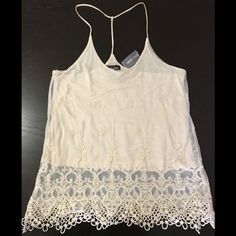 Ivory Double-Layered Camisole. Bottom Layer Is Cotton For Coverage While Top Layer Is Sheer With 3d Design Lace Embroidery. 2 Straps On Shoulders Combine Behind Neck Into 1 Strap For A Racer Back Style. This Versatile Top Can Easily Be Dressed Up Or Down For A Night Out For A Delicate Look Or A Casual Day And Still Look Cute! Brand New With Tag! (Tag Price Torn) Non-Smoking/Pet-Free Home. Lace V-neck Camisole For Summer, Summer Lace Camisole For Party, Summer Party Lace Camisole Top, Lace Trim Camisole For Party In Spring, Spring Party Camisole With Lace Trim, Spring Party Lace Trim Camisole, Summer Lace Camisole Top, Sheer Cami Lace Top For Summer, V-neck Lace Tank Top For Summer