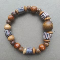 Lightweight But Chunky: This Bracelet Is A Mix Of Varying Wood Tones With Striped Antique African Trade Bead Accents. I'd Say It's Fairly Unisex. - M/L - Strung On Clear, Strong Elastic Let's Hear It For Power Neutrals! ~*Pennyroyal* Large Bead Bracelet, Wooden Beads Bracelet, Fall Bracelets, African Trade Bead Jewelry, African Beaded Bracelets, Silver Braided Bracelet, Wooden Bead Bracelet, Wooden Bead Jewelry, African Inspired Jewelry