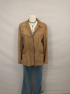 "Classic vintage lightly sueded leather jacket, comfortable casual style natural tan color. Quality construction and nice detail. Unique piece for casual wear or street wear. Front pockets. Fully lined inside. Condition is good, small spots no major stains, no rips or damage, lots of life left. Some minor shredding and spots on lining. Soft lightweight leather with light natural wear. No size marked - please go by measurements. Shown on a 6 mannequin. Label is Leathers by New England Sports wear Classic Brown Suede Outerwear, Casual Leather Blazer With Pockets, Brown Single Breasted Suede Outerwear, Fall Suede Blazer With Pockets, Casual Suede Outerwear With Button Closure, Brown Suede Leather Jacket For Work, Casual Suede Leather Jacket For Winter, Brown Suede Outerwear For Spring, Casual Suede Leather Jacket With Pockets