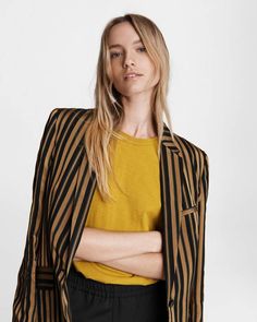 A feminine spin on traditional tailored menswear, this hip-length, single-button closure striped blazer is made from an elegant silk and viscose blend. Features horn fisheye buttons . rag & bone Women's Tailored Fit Blazer | Gold Stripe, 10 (also in 00,0,2,4,6,8,12) Chic Striped Formal Blazer, Chic Striped Blazer For Formal Occasions, Chic Striped Office Blazer, Chic Tailored Striped Blazer, Tailored Spring Blazer With Vertical Stripes, Chic Striped Blazer For Business Casual, Fall Striped Notch Lapel Blazer, Tailored Menswear, Women Coats