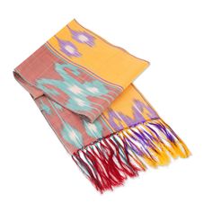 Add a splash of color to your look with this heavenly scarf entirely woven by hand in 100% silk with striking ikat patterns and a delicate fringe on both ends. This lovely fashion accessory by Uzbekistan's Nurmukhammad Valiyev features bright shades in a nod to the colors of the sunrise in the city of Samarkand, one of the oldest cities of Central Asia renowned for ikat textiles and once part of the traditional Silk Road trade route. Multicolor Tussar Silk Scarf With Traditional Drape, Red Ikat Print Tussar Silk Dupatta, Sunrise In The City, Ikat Textiles, Luxury Silk Ikat Print Dupatta, Ikat Scarf, Uzbek Ikat, Lovely Fashion, Scarf Handmade