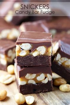 three pieces of candy bar fudge stacked on top of each other with cashews