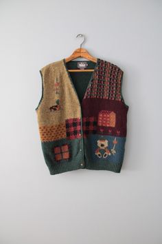 vintage rare essential cabin/cottage core aesthetic dark autumn color warmest wool intarsia knitwork vest. featuring cutest bear, duck and farm house in moody autumn front and pine green back. embossed flower buttons in antiqued brass.  100% wool   Made by Woolrich  Fits best like oversize or large (tag vintage size L): 16" shoulders 44" bust 22" length Condition: excellent! ✮ shop our selection of vintage knitwear here: https://etsy.me/3XGKMBb ✮ shop The Veiled Ghost handmade jewelry: https://etsy.me/32CDNCC ✮ shop Adrian Company Vintage: https://etsy.me/3u2Ewbi Knitwear Aesthetic, Moody Autumn, Etiquette Vintage, Cabin Cottage, Vintage Knitwear, Dark Autumn, Cottage Core Aesthetic, Wool Vest, Pine Green