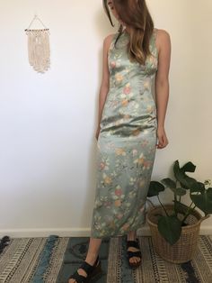 100% Silk Vintage Laura Ashley dress in sage green with floral pattern.  Beautiful and comfortable dress, perfect for a formal event.  Size 8 AUS Silk Maxi-length Floral Dress For Garden Party, Silk Maxi Floral Dress For Garden Party, Silk Floral Maxi Dress For Garden Party, Elegant Silk Floral Dress For Garden Party, Spring Silk Floral Maxi Dress, Spring Floral Print Silk Dress For Formal Occasions, Elegant Spring Silk Dress With Floral Print, Green Floral Print Satin Dress, Satin Maxi Dress With Floral Print For Garden Party