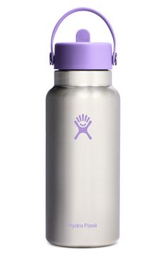 the hydro flask water bottle has a purple lid and is in front of a white background