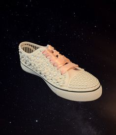 These custom sneakers are pearl and rhinestone mix all over the shoe with all diamond like rhinestone toe accents. The satin ribbon shoe lace and custom details will be in Light Pink color, other pictures to show details.  I can customize this shoe for any occasion, wedding, Quince, or anything you desire.  I make these per order, the pearls and rhinestones are all hand placed with no pattern,  the custom details are not iron on or paint, they are also hand placed rhinestones. You provide the cu Ribbon Shoe Laces, Ribbon Shoes, Bridal Sneakers, Pearl Shoes, Wedding Sneakers, Rhinestone Shoes, Light Pink Color, Custom Sneakers, Shoes Trainers