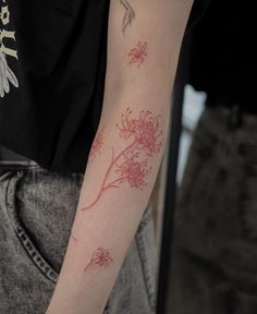 a person with a flower tattoo on their arm