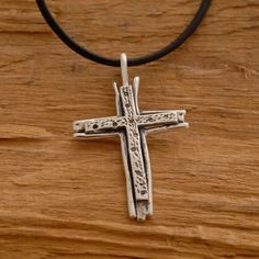 Share the spirit of faith with someone you hold dear. This sterling silver double cross necklace is a fitting gift for anyone on your gift list. It features two sterling silver crosses that have been hand-designed and melded together in a harmony of design. Suspended from a sterling silver chain or a leather cord with silver clasp and endings. It makes a gorgeous accessory that can be worn every day or reserved for those special occasions. It provides you with the unique opportunity to accessori Spiritual Sterling Silver Cross Necklace For Anniversary, Sterling Silver Cross Pendant Necklace For Anniversary, Spiritual Crucifix Cross Necklace For Anniversary, Silver Crucifix Cross Necklace For Anniversary, Adjustable Sterling Silver Crucifix Necklace, Handmade Sterling Silver Cross Pendant Necklace, Sterling Silver Cross Pendant Jewelry, Nickel Free Sterling Silver Cross Necklace, Nickel-free Sterling Silver Cross Pendant Necklace