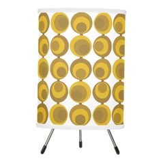 a yellow and white lamp with circles on it