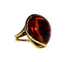 Spectacular ring handcrafted with sterling silver covered 14ct. gold and natural Baltic amber.Fabulous big cherry amber stone (like drop of red wine ) fitted in beautiful gold setting.This gorgeous jewellery suitable for everyday end evening wear.Amber stone created by nature over 25 millions years ego, amber attracts good luck, balances emotions, dissolves negative energy. Care Instructions: To maintain your jewellery, wipe gently with a cotton cloth that is soft and clean. Do not soak in water Formal Amber Oval Cabochon Rings, Formal Amber Open Ring Jewelry, Handmade Brown Rings For Formal Occasions, Formal Brown Handmade Rings, Formal Handmade Brown Rings, Amber Cabochon Ring, Elegant Amber Cabochon Ring, Handmade Amber Oval Cabochon Rings, Unique Amber Open Ring