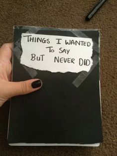 someone holding up a book with writing on it that says things i wanted to say but never did