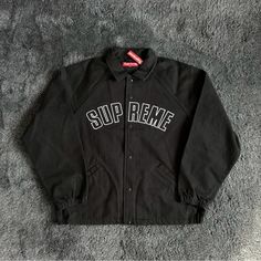 Supreme Black Long Sleeve Cotton Windbreaker, Black Windbreaker For Streetwear In Fall, Black Windbreaker For Fall Streetwear, Black Fall Windbreaker For Streetwear, Black Hooded Varsity Jacket For Spring, Classic Long Sleeve Varsity Jacket For Streetwear, Hooded Black Varsity Jacket For Spring, Black Spring Outerwear For Streetwear, Spring Black Streetwear Outerwear