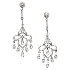 A pair of modern briolette diamond and white gold drop earrings, with round brilliant-cut diamond micro pavé set cluster tops and openwork drops, set with round brilliant-cut diamonds, suspending briolette-cut diamond pendants, with a total diamond weight of 7.23 carats, mounted in 18ct white gold, with post and butterfly fittings. Briolette Diamond, White Gold Drop Earrings, Diamond Pendants, Gold Drop Earrings, Dream Jewelry, Belle Epoque, Underworld, Micro Pave, Round Brilliant Cut Diamond