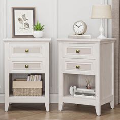 two white nightstands side by side with a clock on top and a basket underneath