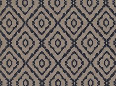 an area rug with blue and grey designs on it