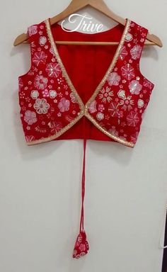 This Made to Order/Made to Measurement/Custom Made Indian Ethnic Blouse. - Fabric - Embroidered Georgette - Color  Red color - Princess Cut - Rich Lined - Shoulder string with latkans - Sleeveless - Extra margin and extra stitches included in the blouse - It can be customize in any color, design or size  MEAUREMENTS & CUSTOMIZATIONS This blouse can be purchased in your standard sizing and pattern. Please choose your Chest Size (measured in inches) from the drop-down box.. For custom sizing pleas Festive V-neck Choli With Mirror Work, Red V-neck Sets For Navratri, Traditional V-neck Choli With Resham Embroidery, V-neck Choli With Pallu For Puja, Diwali Floral Embroidered Fitted Choli, Sleeveless Traditional Wear With Resham Embroidery, Navratri Choli With Floral Embroidery, Fitted Choli With Floral Embroidery For Festivals, Red Floral Embroidered Choli For Festivals