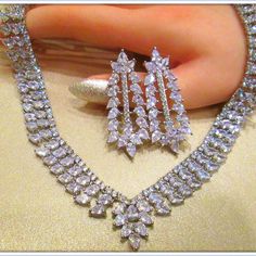 This Breathtaking Necklace And Earring Set Will Add Red Carpet Glamor To Your Wedding Ensemble. This Lavish Jewelry Set Is For The Bride Who Loves Attention Getting, Head-Turning Bling In A Luxury Design! You Want A Stone That Looks, Feels, And Acts Like A Diamond But Is Also Affordable, Eco-Friendly, And Conflict-Free. You’re Not Alone. And, We’re Willing To Bet That Cubic Zircon Is Probably The First Diamond Alternative Popped Into Your Mind. But, Is Cubic Zircon Your Best Option? Thank You Elegant White Jewelry With Stones, White Gold Cubic Zirconia Jewelry With Stones, Fine Jewelry Sets With Sparkling Stones For Party, Cubic Zirconia Jewels Jewelry Sets For Celebration, Cubic Zirconia Jeweled Jewelry Sets For Celebration, Cubic Zirconia Jewelry Sets For Celebration, Exquisite Crystal Jewelry Sets For Parties, Hand Set Marquise White Gold Jewelry, Silver Marquise Bridal Necklace For Formal Occasions