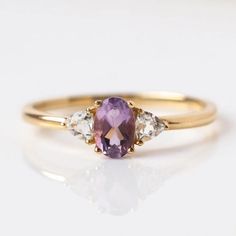 14K Solid Gold Amethyst Ring-Purple Amethyst Ring-Three Stone Ring-Minimalist Ring-Rose Gold Ring-Silver Amethyst Ring-Amethyst Women's Ring Description: Main Stone -  Amethyst(Lab Created ) Stone Size - 8x6 mm Stone color - Purple Stone shape - Oval Second Stone - CZ Diamond  Stone Shape -Round Stone Color - Trilliant Finishing- Excellent feel free to contact me if you have any questions Gemstone color may slightly vary from listed image due to the nature of all natural gemstone or different mo Luxury Amethyst Three Stone Ring As Gift, Luxury Elegant Three Stone Amethyst Ring, Luxury Round Amethyst Ring With Accent Stones, Luxury Three Stone Amethyst Ring As Gift, Luxury Elegant Three-stone Amethyst Ring, 3 Stone Purple Amethyst Ring, Gold Amethyst Ring, Local Eclectic, Amethyst Ring Engagement